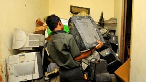 A person disposes of e-waste at a scrap dealer’s place in Noida.(Sunil Ghosh/HT File Photo) A person disposes of e-waste at a scrap dealer’s place in Noida.(Sunil Ghosh/HT File Photo)