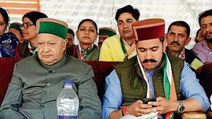 CM Virbhadra Singh with his son Vikramaditya Singh in Shimla (rural) assembly segment on Saturday.(HT Photo) CM Virbhadra Singh with his son Vikramaditya Singh in Shimla (rural) assembly segment on Saturday.(HT Photo)