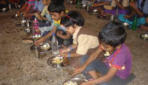 Students having their mid-day meal. The mid-day meal is the world’s biggest lunch programme aimed at promoting education and fighting malnutrition. (HT photo) Students having their mid-day meal. The mid-day meal is the world’s biggest lunch programme aimed at promoting education and fighting malnutrition. (HT photo)