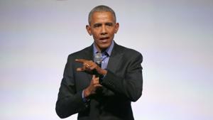 Former US president Barack Obama addresses the crowd as the last speaker at final session of the Obama Foundation Summit.(AP) Former US president Barack Obama addresses the crowd as the last speaker at final session of the Obama Foundation Summit.(AP)