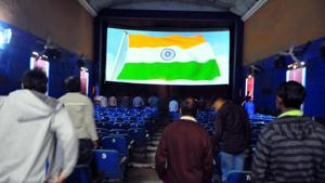 Citizens stand as the national anthem is played before a movie at a theatre. The BJP government in Jharkhand will make singing of the national anthem mandatory in madrasas and schools.(HT File Photo / Representative) Citizens stand as the national anthem is played before a movie at a theatre. The BJP government in Jharkhand will make singing of the national anthem mandatory in madrasas and schools.(HT File Photo / Representative)