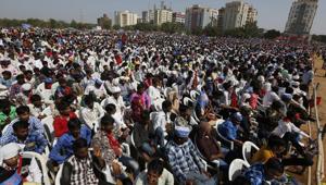People sit during a rally in Gandhinagar on October 23.(AP File Photo) People sit during a rally in Gandhinagar on October 23.(AP File Photo)