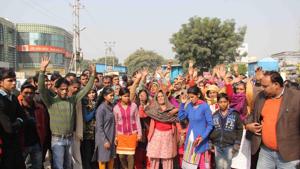 Locals protest outside the high-rise on Monday. Locals protest outside the high-rise on Monday.