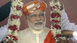 Prime Minister Narendra Modi being garlanded at an election campaign rally in Lunawada town of Panchmahal district in Gujarat on Saturday.(PTI) Prime Minister Narendra Modi being garlanded at an election campaign rally in Lunawada town of Panchmahal district in Gujarat on Saturday.(PTI)