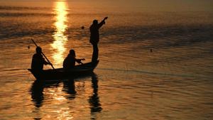 Fishermen at the Brahmaputra river during sunset in Guwahati.(AFP File Photo) Fishermen at the Brahmaputra river during sunset in Guwahati.(AFP File Photo)