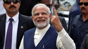 Prime Minister Narendra Modi shows his ink-marked finger after casting his vote outside a polling station during the last phase of Gujarat assembly election in Ahmedabad.(Reuters) Prime Minister Narendra Modi shows his ink-marked finger after casting his vote outside a polling station during the last phase of Gujarat assembly election in Ahmedabad.(Reuters)