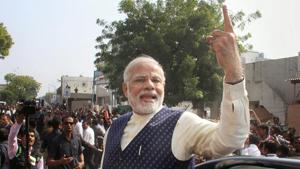 Prime Minister Narendra Modi shows his finger marked with indelible ink, as he leaves after casting his vote, during the second phase of state Assembly elections in Ahmedabad(PTI) Prime Minister Narendra Modi shows his finger marked with indelible ink, as he leaves after casting his vote, during the second phase of state Assembly elections in Ahmedabad(PTI)