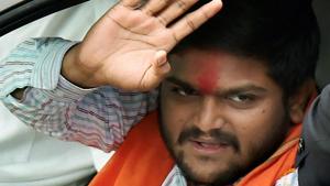 Patidar community leader Hardik Patel waves at supporters during a road show for the second phase of Gujarat assembly elections, in Ahmedabad.(PTI Photo) Patidar community leader Hardik Patel waves at supporters during a road show for the second phase of Gujarat assembly elections, in Ahmedabad.(PTI Photo)