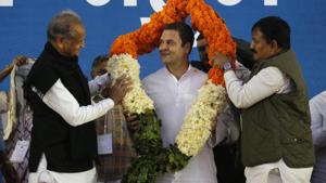 Congress president Rahul Gandhi, centre, is presented with a garland during a meeting in Ahmadabad on Saturday.(AP) Congress president Rahul Gandhi, centre, is presented with a garland during a meeting in Ahmadabad on Saturday.(AP)