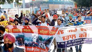 Employees of Guru Nanak Dev Thermal Plant and other unions protesting opposite the office of Punjab finance minister Manpreet Singh Badal in Bathinda on Saturday.(Sanjeev Kumar/HT) Employees of Guru Nanak Dev Thermal Plant and other unions protesting opposite the office of Punjab finance minister Manpreet Singh Badal in Bathinda on Saturday.(Sanjeev Kumar/HT)