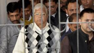 Rashtriya Janata Dal supremo Lalu Prasad Yadav being escorted by police officials after being convicted by the special CBI court in a fodder scam case, in Ranchi, on Saturday.(PTI)