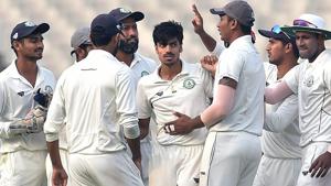 Vidarbha bowler Rajneesh Gurbani’s hat-trick saw the side wrest the initiative from Delhi on Day 2 of the Ranji Trophy final in Indore.(PTI) Vidarbha bowler Rajneesh Gurbani’s hat-trick saw the side wrest the initiative from Delhi on Day 2 of the Ranji Trophy final in Indore.(PTI)