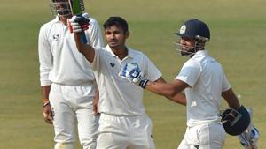 Vidarbha batsman Akshay Wadkar celebrates his century during the 3rd day of the Ranji Trophy final against Delhi in Indore on Sunday.(PTI) Vidarbha batsman Akshay Wadkar celebrates his century during the 3rd day of the Ranji Trophy final against Delhi in Indore on Sunday.(PTI)