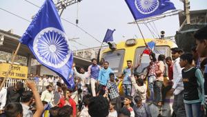 Dalit groups protesting at Thane railway station during the Maharashtra Bandh on Wednesday following clashes between two groups in Bhima Koregaon near Pune(PTI) Dalit groups protesting at Thane railway station during the Maharashtra Bandh on Wednesday following clashes between two groups in Bhima Koregaon near Pune(PTI)