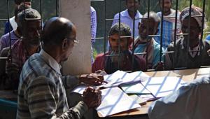 People wait to check their names on the first draft of the National Register of Citizens, released on December 31, at Goroimari in Assam.(AFP Photo) People wait to check their names on the first draft of the National Register of Citizens, released on December 31, at Goroimari in Assam.(AFP Photo)