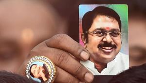 A supporter wears a ring with an image of former chief minister J Jayalalithaa's, as he shows a photograph of AIADMK leader TTV Dhinakaran after his swearing-in ceremony, at Secretariat in Chennai, on December 29, 2017.(PTI) A supporter wears a ring with an image of former chief minister J Jayalalithaa's, as he shows a photograph of AIADMK leader TTV Dhinakaran after his swearing-in ceremony, at Secretariat in Chennai, on December 29, 2017.(PTI)