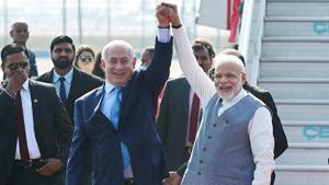 Prime Minister Narendra Modi with his Israeli counterpart Benjamin Netanyahu upon his arrival at Air Force station Palam in New Delhi on Sunday.(PTI Photo) Prime Minister Narendra Modi with his Israeli counterpart Benjamin Netanyahu upon his arrival at Air Force station Palam in New Delhi on Sunday.(PTI Photo)