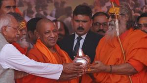 Hindu spiritual leader Jyotir Pitha Shankaracharya Vasudevanand Saraswati, right, presents a pot filled with holy water to Uttar Pradesh chief minister Yogi Adityanath at a meeting organised by the Vishwa Hindu Parishad during the annual Magh Mela fair in Allahabad on Friday.(AP Photo) Hindu spiritual leader Jyotir Pitha Shankaracharya Vasudevanand Saraswati, right, presents a pot filled with holy water to Uttar Pradesh chief minister Yogi Adityanath at a meeting organised by the Vishwa Hindu Parishad during the annual Magh Mela fair in Allahabad on Friday.(AP Photo)