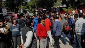 Crowd gathered outside the temple in Raipur area in Dehradun.(Vinay Santosh Kumar/HT Photo)