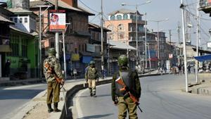 Security personnel patrol a street during restrictions in Srinagar on Sunday. Authorities imposed restrictions in the view of the strike called by separatists to protest against the killing of two youths in Army firing in Shopian district on Saturday.(PTI Photo) Security personnel patrol a street during restrictions in Srinagar on Sunday. Authorities imposed restrictions in the view of the strike called by separatists to protest against the killing of two youths in Army firing in Shopian district on Saturday.(PTI Photo)
