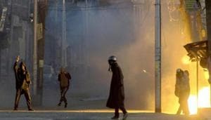 A teargas shell explodes near the protesters who were clashing with security forces following a protest against the alleged killing of two youth Army firing in Shopian district of South Kashmir, in Srinagar on Sunday.(PTI File Photo) A teargas shell explodes near the protesters who were clashing with security forces following a protest against the alleged killing of two youth Army firing in Shopian district of South Kashmir, in Srinagar on Sunday.(PTI File Photo)