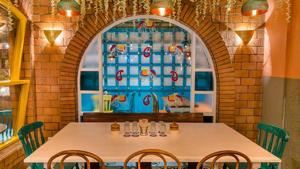 While the ceiling is decorated with plastic flowers, the decor of the restaurant does feature some real green plants.(Photo: Facebook.com/MadrasDiariesRestaurant) While the ceiling is decorated with plastic flowers, the decor of the restaurant does feature some real green plants.(Photo: Facebook.com/MadrasDiariesRestaurant)