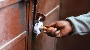 A municipal official sealing a property at East Patel Nagar in New Delhi February 1.(Sanchit Khanna/HT Photo) A municipal official sealing a property at East Patel Nagar in New Delhi February 1.(Sanchit Khanna/HT Photo)