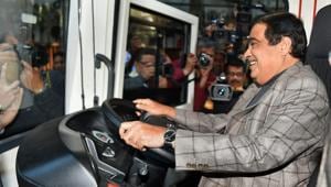 Union minister Nitin Gadkari sits on the driving seat of an electric vehicle. The transition towards electric mobility requires not just private sector participation but also massive public buy-in(PTI)