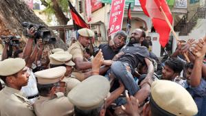 Police personnel in Coimbatore restrain members of Thanthai Periyar Dravida Kalagham who were protesting against the Supreme Court’s order reducing Tamil Nadu’s share in Cauvery waters.(PTI) Police personnel in Coimbatore restrain members of Thanthai Periyar Dravida Kalagham who were protesting against the Supreme Court’s order reducing Tamil Nadu’s share in Cauvery waters.(PTI)