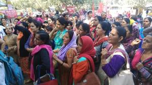 NHM workers protested outside the Civil Hospital in Gurgaon on Tuesday.