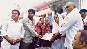 Hemaben Vankar received the land title for an eight hectare patch of land in Dudhka village on February 20, after activist Bhanubhai Vankar set himself on fire in protest against delays.(HT Photo) Hemaben Vankar received the land title for an eight hectare patch of land in Dudhka village on February 20, after activist Bhanubhai Vankar set himself on fire in protest against delays.(HT Photo)