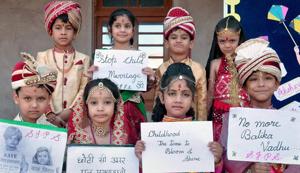 School children take part in an awareness campaign to stop child marriages during Akshaya Tritiya, Bikaner, Rajasthan, 2016(PTI) School children take part in an awareness campaign to stop child marriages during Akshaya Tritiya, Bikaner, Rajasthan, 2016(PTI)