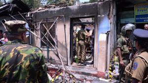 Sri Lanka's Special Task Force and Police officers stand guard near a burnt house after a clash between two communities in Digana, central district of Kandy in Sri Lanka.(Reuters File Photo) Sri Lanka's Special Task Force and Police officers stand guard near a burnt house after a clash between two communities in Digana, central district of Kandy in Sri Lanka.(Reuters File Photo)