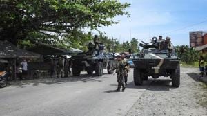 Philippine soldiers standing next to their armoured personnel carriers, as they man a checkpoint along a highway near the clash site between government troops and Islamic militants in Datu Saudi Ampatuan town, Maguindanao province, on the southern island of Mindanao on March 8.(AFP Photo) Philippine soldiers standing next to their armoured personnel carriers, as they man a checkpoint along a highway near the clash site between government troops and Islamic militants in Datu Saudi Ampatuan town, Maguindanao province, on the southern island of Mindanao on March 8.(AFP Photo)