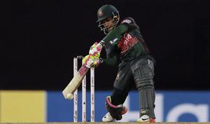Bangladesh's Mushfiqur Rahim plays a shot against India during their second Twenty20 cricket match in Nidahas triangular series in Colombo, Sri Lanka, Wednesday.(AP) Bangladesh's Mushfiqur Rahim plays a shot against India during their second Twenty20 cricket match in Nidahas triangular series in Colombo, Sri Lanka, Wednesday.(AP)