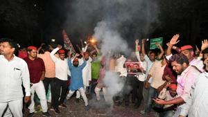 Samajwadi Party supporters celebrate the win in Phulpur and Gorakhpur bypolls, in front of the party office in Lucknow on Wednesday.(PTI Photo) Samajwadi Party supporters celebrate the win in Phulpur and Gorakhpur bypolls, in front of the party office in Lucknow on Wednesday.(PTI Photo)