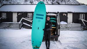 Myrtille Heissat, 26, a surf instructor from France, in Unstad, northern Norway.(AFP) Myrtille Heissat, 26, a surf instructor from France, in Unstad, northern Norway.(AFP)