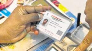 An Indian visitor gives a thumb impression to withdraw money from his bank account with his Aadhaar or Unique Identification (UID) card during a Digi Dhan Mela, held to promote digital payment, in Hyderabad on January 18, 2017. The Digi Dhan mela is a government initiative aimed at digital transformation in the country following the recent demonetization. / AFP PHOTO / Noah SEELAM(AFP) An Indian visitor gives a thumb impression to withdraw money from his bank account with his Aadhaar or Unique Identification (UID) card during a Digi Dhan Mela, held to promote digital payment, in Hyderabad on January 18, 2017. The Digi Dhan mela is a government initiative aimed at digital transformation in the country following the recent demonetization. / AFP PHOTO / Noah SEELAM(AFP)
