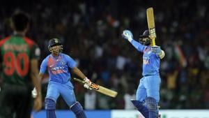 India's Dinesh Karthik, right, celebrates scoring the winning runs to defeat Bangladesh by four wickets during the final of the Nidahas Trophy triangular Twenty20 cricket series in Colombo on Sunday.(AP) India's Dinesh Karthik, right, celebrates scoring the winning runs to defeat Bangladesh by four wickets during the final of the Nidahas Trophy triangular Twenty20 cricket series in Colombo on Sunday.(AP)