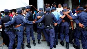 Maldivian Police officers push back opposition supporters near the main opposition Maldives Democratic Party (MDP) headquarters during a protest demanding the government to release jailed opposition leaders, including former Presidents Mohamed Nasheed and Maumoon Abdul Gayoom in line with a last week Supreme Court order in Male.(REUTERS File Photo) Maldivian Police officers push back opposition supporters near the main opposition Maldives Democratic Party (MDP) headquarters during a protest demanding the government to release jailed opposition leaders, including former Presidents Mohamed Nasheed and Maumoon Abdul Gayoom in line with a last week Supreme Court order in Male.(REUTERS File Photo)