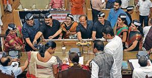 Corporators give toy cars to Pune mayor and commissioner during the PMC general body meeting as part of their protest against the proposed new parking policy, on Friday.(Pratham Gokhale/HT Photo) Corporators give toy cars to Pune mayor and commissioner during the PMC general body meeting as part of their protest against the proposed new parking policy, on Friday.(Pratham Gokhale/HT Photo)