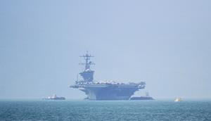 The USS Carl Vinson (CVN-70), the US Navy's nuclear-powered Nimitz-class aircraft carrier, pulls into port in Danang on March 5, 2018.(AFP) The USS Carl Vinson (CVN-70), the US Navy's nuclear-powered Nimitz-class aircraft carrier, pulls into port in Danang on March 5, 2018.(AFP)