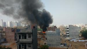 Fire broke out in a slum near Tigra village in Gurgaon on Monday.(HT Photo) Fire broke out in a slum near Tigra village in Gurgaon on Monday.(HT Photo)