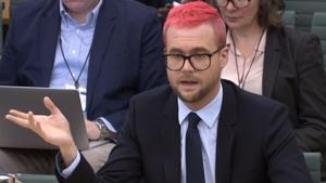 A video grab from footage broadcast by the UK Parliament's Parliamentary Recording Unit shows Canadian data analytics expert Christopher Wylie appearing as a witness before the Digital, Culture, Media and Sport Committee of members of the British parliament at the Houses of Parliament in central London on Tuesday.(AFP) A video grab from footage broadcast by the UK Parliament's Parliamentary Recording Unit shows Canadian data analytics expert Christopher Wylie appearing as a witness before the Digital, Culture, Media and Sport Committee of members of the British parliament at the Houses of Parliament in central London on Tuesday.(AFP)