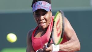 Venus Williams hits a return to Johanna Konta during the Miami Open tennis tournament on Monday.(AP)