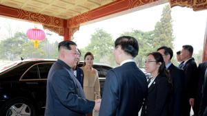 North Korean leader Kim Jong Un and his wife Ri Sol Ju being greeted by Chinese officials in Beijing, March 26.(AFP) North Korean leader Kim Jong Un and his wife Ri Sol Ju being greeted by Chinese officials in Beijing, March 26.(AFP)