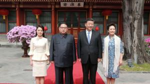 North Korean leader Kim Jong Un and wife Ri Sol Ju, and Chinese President Xi Jinping and wife Peng Liyuan pose for a photo in Beijing, China, in this undated photo released by North Korea's Korean Central News Agency (KCNA) in Pyongyang March 28, 2018.(KCNA/via Reuters) North Korean leader Kim Jong Un and wife Ri Sol Ju, and Chinese President Xi Jinping and wife Peng Liyuan pose for a photo in Beijing, China, in this undated photo released by North Korea's Korean Central News Agency (KCNA) in Pyongyang March 28, 2018.(KCNA/via Reuters)