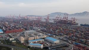 A container ship is docked at the Yangshan port in Shanghai on March 29.(AP Photo) A container ship is docked at the Yangshan port in Shanghai on March 29.(AP Photo)