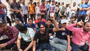 Students sit in protest outside the CBSE office in New Delhi on Saturday.(Raj K Raj/HT Photo) Students sit in protest outside the CBSE office in New Delhi on Saturday.(Raj K Raj/HT Photo)