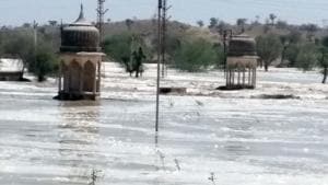 An area flooded after the breach in a reservoir at Malsisar in Jhunjhunu district on Saturday.(HT Photo) An area flooded after the breach in a reservoir at Malsisar in Jhunjhunu district on Saturday.(HT Photo)